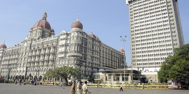 Indian policemen patrol in Mumbai on November 26, 2011. Indian investigators seized more than 100 bags stuffed with cash, gold and diamond jewellery during a raid on four trucks in Mumbai, marking one of the city's largest such hauls, reports and officials said Wednesday.