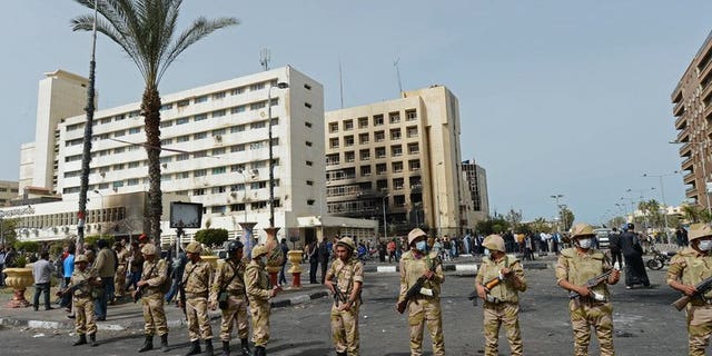 Egyptian soldiers stand guard in front of the Port Said security headquarters on March 8, 2013. Senior military commanders were in emergency talks on Wednesday after Egypt's embattled President Mohamed Morsi rejected their ultimatum to resolve the current crisis, a source close to the military told AFP.