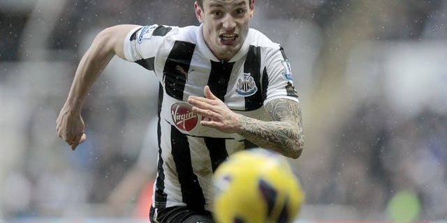 Newcastle United's Mathieu Debuchy chases down the ball during a league match against Reading at St James Park, on January 19, 2013. Debuchy has played down media speculation linking him with big-spending Ligue 1 giants Paris Saint-Germain and Monaco by declaring that he is happy in England.