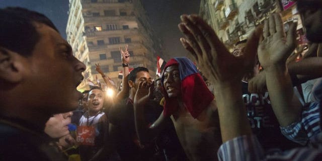 People celebrate at Tahrir Square after the announcement that President Mohamed Morsi was being toppled, on July 3, 2013 in Cairo. Egypt's new caretaker president Adly Mansour had been head of the Supreme Constitutional Court for just two days when the army named him leader of the Arab world's most populous state.
