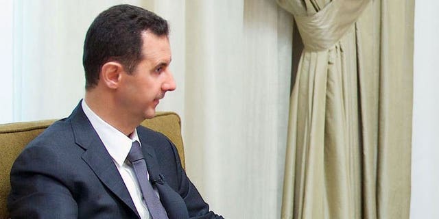A handout picture released by the Syrian Arab News Agency (SANA) shows President Bashar al-Assad giving an interview to a local newspaper in Damascus, on July 2, 2013. Assad has accused the West of sending "takfiri terrorist groups" to his country as a way to get rid of them, in an interview with a Syrian daily.