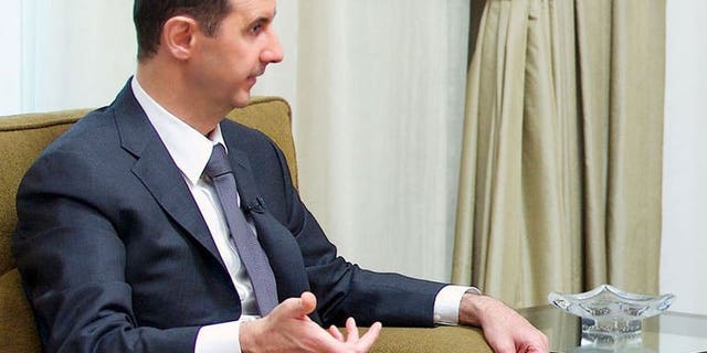 A handout picture released by the Syrian Arab News Agency (SANA) shows President Bashar al-Assad giving an interview to a local newspaper in Damascus, on July 2, 2013. Assad has accused the West of sending "takfiri terrorist groups" to his country as a way to get rid of them, in an interview with a Syrian daily.