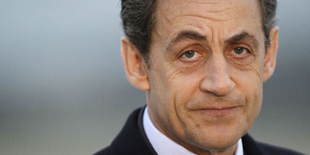 A photo taken on March 2, 2012 shows France's President Nicolas Sarkozy at the military airport of Villacoublay outside Paris. Sarkozy on Thursday resigned from France's top constitutional body after it upheld a decision that he had exceeded official spending limits during last year's election campaign.