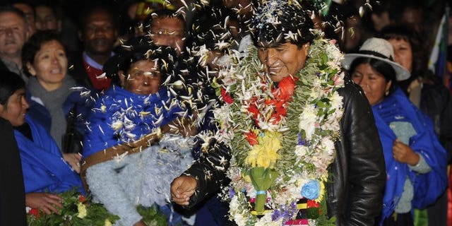 Bolivian President Evo Morales is greeted upon arrival at El Alto Airport late on July 3, 2013 in La Paz. Leftist Latin American leaders gathered in Bolivia on Thursday to back Morales, fuming after some European nations temporarily refused his plane access to their airspace amid suspicions US fugitive Edward Snowden was aboard.