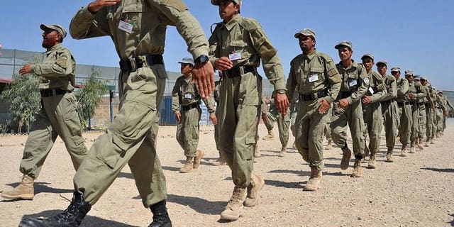 Afghan police march during a graduation ceremony at a police training centre on the outskirts of Jalalabad on July 4, 2013. A suicide bomber killed 12 policemen in the southern Afghan province of Uruzgan on Friday when he blew himself up inside a police station as officers ate lunch in a dining hall, officials said.