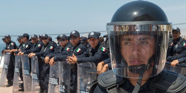 Mexican Federal Police carry out a drill on June 13, 2012, in Cabo San Lucas, Baja California, Mexico. Candidates have been killed and others threatened in campaigning ahead of local elections Sunday in Mexico -- the first voting since a new president took over with a pledge to reduce violence.