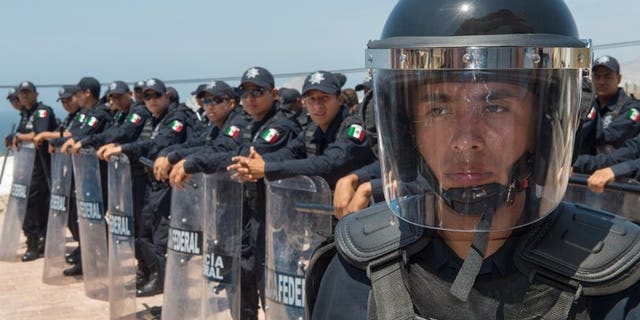 Mexican Federal Police carry out a drill on June 13, 2012, in Cabo San Lucas, Baja California, Mexico. Candidates have been killed and others threatened in campaigning ahead of local elections Sunday in Mexico -- the first voting since a new president took over with a pledge to reduce violence.