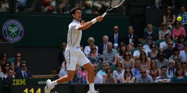 Novak Djokovic makes a return against Juan Martin Del Potro at Wimbledon on Friday. Novak Djokovic won the first set of his Wimbledon semi-final 7-5 against Juan Martin del Potro on Friday.