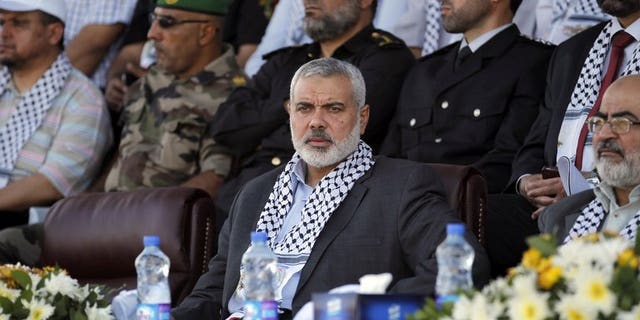 Hamas Prime Minister in the Gaza Strip Ismail Haniya attends a Palestinian Hamas police graduation ceremony in Deir al-Balah in the central Gaza Strip on May 28, 2013. Haniya appealed in a Friday sermon to have faith in the Arab Spring despite the ouster of Egypt's Islamist president Mohamed Morsi by the army.