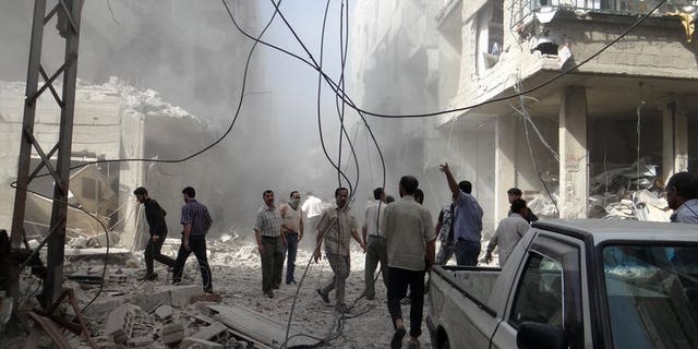 A picture released by the Syrian opposition-run Shaam News Network shows the aftermath of an air strike in the suburbs of Damascus on July 6, 2013. Syrian warplanes have launched a series of strikes on the outskirts of Damascus as President Bashar al-Assad's regime press a bid to drive back rebels, a monitoring group says.