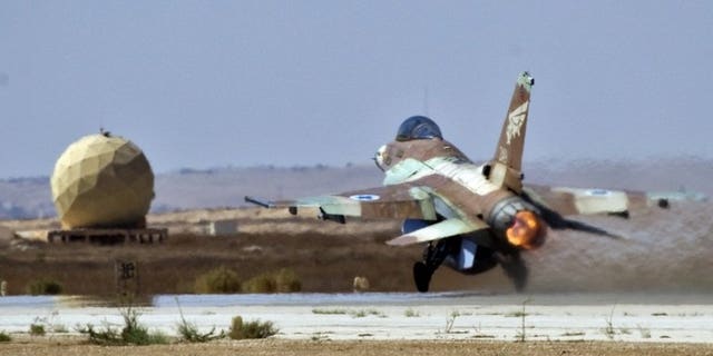 An Israeli F-16 fighter jet takes off at the Nevatim air force base near Beersheva on October 6, 2010. An Israeli warplane has crashed into the Mediterranean Sea following a malfunction although both crew members were rescued unharmed, a military spokesman tells AFP.