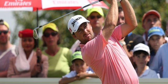 Graeme McDowell of Northern Ireland plays a shot during the final round of the French Open on July 7, 2013 at Le Golf National in Guyancourt, near Paris. McDowell produced a four-under-par final round of 67 to win the Open by four strokes on Sunday.