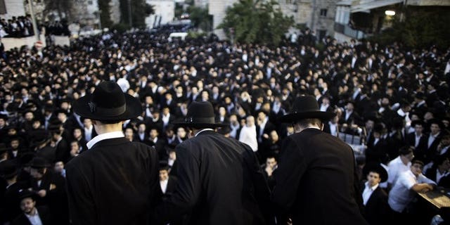 Thousands of ultra-Orthodox Jews gather in front of the main army recruitment office in Jerusalem on May 16, 2013 to demonstrate against any plans to make them undergo military service. The Israeli government on Sunday approved a draft law which will spell the end of a system which has seen tens of thousands of ultra-Orthodox exempt from military service.