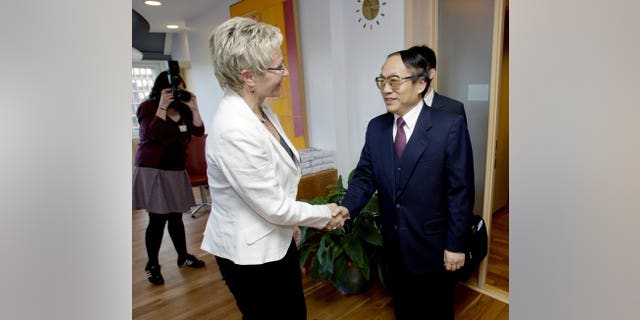 Then minister for Chinese railways, Liu Zhijun (R), meets Norwegian officials in Oslo on May 11, 2009. Liu was given a suspended death sentence on Monday for his role in a huge corruption scandal.