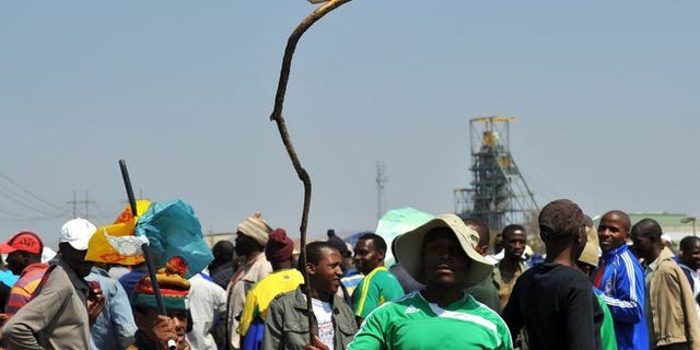 A sign in Rustenburg last September reads 12,500 rand, the wage sought by Amplats miners. Moody's rating agency on Monday warned South African banks and other lenders which issue loans without collateral face a bumpy time ahead as the economy wobbles and labour unrest continues.