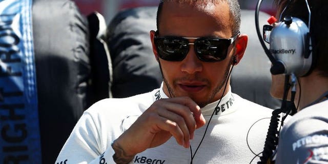 British Formula One driver Lewis Hamilton of Mercedes AMG pictured before the start of the German Formula One Grand Prix at the Nurburgring race in Nuerburg, Germany on July 7, 2013. Hamilton's hopes of registering his maiden victory for his new Mercedes team have suffered a setback with the revised tyre regulations introduced at last weekend's German Grand Prix at the Nurburgring.