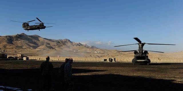 A US military helicopter prepares to land at a US base in Maidan Shar Wardak province on January 11, 2011. Afghanistan's intelligence agency is holding an Afghan-American translator on suspicion of torturing and killing civilians while working for US special forces, officials said Monday