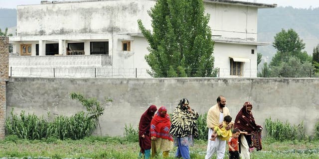 A Pakistani family leaves after visiting the hideout house of slain Al-Qaeda leader Osama bin Laden in Abbottabad on May 5, 2011. Pakistani collective failures, incompetency and negligence allowed Al-Qaeda leader Osama bin Laden to live in the country undetected for more than nine years, a leaked report has revealed Monday.