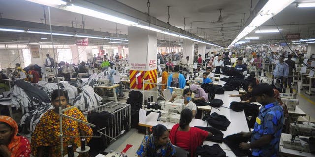 In this photograph taken on June 23, 2010, Bangladeshi women sew clothes in a garment factory in Ashulia. Output from Bangladesh's accident-prone garment sector has increased in June, with demand from foreign retailers still growing despite the country's factory disaster in April.