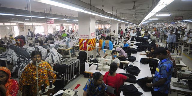 In this photograph taken on June 23, 2010, Bangladeshi women sew clothes in a garment factory in Ashulia. Output from Bangladesh's accident-prone garment sector has increased in June, with demand from foreign retailers still growing despite the country's factory disaster in April.