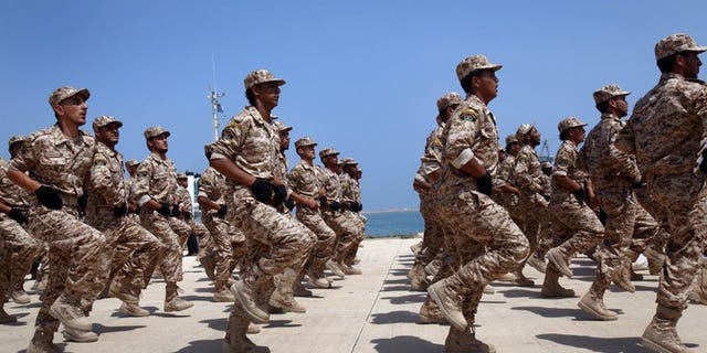 Libyan soldiers march during their graduation ceremony in Tripoli, on July 3, 2012. Britain is to train up to 2,000 Libyan troops in a bid to "help them achieve peace and stability across their country", the British defence ministry announced
