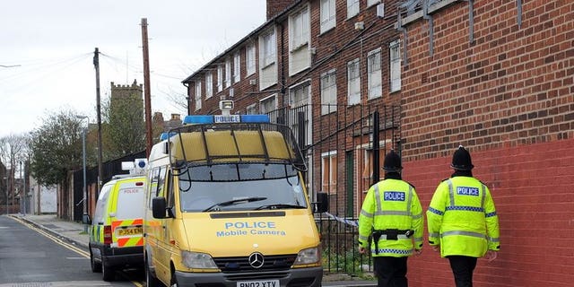 Police officers patrol in Liverpool, northwest England, on April 10, 2009. An British online "troll" who sparked a security alert in the United States by threatening on Facebook to kill 200 schoolchildren was jailed on Tuesday for two years and four months.