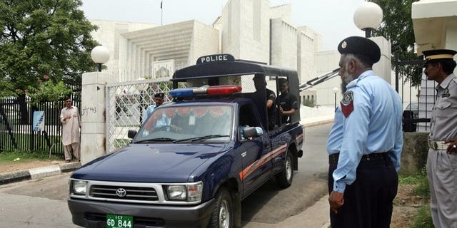 Pakistani police commandos patrol in Islamabad on July 20, 2007. Pakistani investigators brought home the country's fugitive former oil and gas chief from the United Arab Emirates on Tuesday to face allegations in an $850 million corruption case.