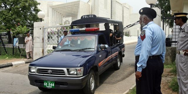 Pakistani police commandos patrol in Islamabad on July 20, 2007. Pakistani investigators brought home the country's fugitive former oil and gas chief from the United Arab Emirates on Tuesday to face allegations in an $850 million corruption case.