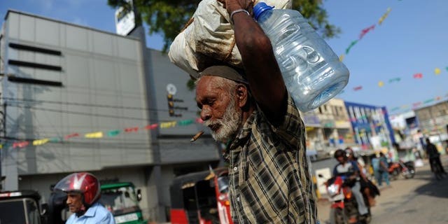 A Sri Lankan Tamil man walks through Jaffna, on May 4, 2012. India has urged Sri Lanka to honour international pledges and share political power with ethnic Tamils after Colombo signalled it will dilute an Indian-brokered devolution plan.