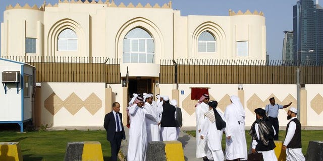 Guests arrive for the opening ceremony of the new Taliban political office in Doha on June 18, 2013. The Taliban have temporarily closed their office in Qatar, where it was hoped a peace deal would be brokered with the US and Afghanistan, blaming "broken promises", an insurgent official said.