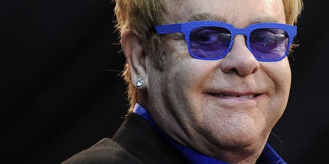 Elton John performs on stage during the Poupet festival on July 3, 2013 in Saint-Laurent-sur-Sevre, western France. John has cancelled the rest of his European tour after he was struck down with appendicitis, his spokesman said on Tuesday.