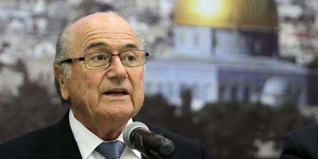 FIFA President Sepp Blatter speaks in the West Bank city of Ramallah on July 7, 2013. Blatter urged Israel on Tuesday to ease restrictions on the movement of Palestinian players and officials that have long dogged the development of football in the West Bank and Gaza Strip.