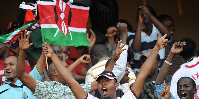Kenyan soccer fans celebrate at the Moi International Sports Centre Kasarani in Nairobi on November 14, 2009. An Edwin Lavatsa brace gave Kenya a 2-0 win over Swaziland Tuesday and top place in Group B of the Cosafa Cup.