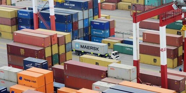 Shipping containers at port in Qingdao, east China, on May 8, 2013. China's monthly trade surplus fell 14.0 percent in June to $27.13 billion, government data showed, as imports and exports both declined.