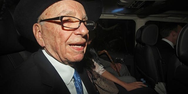 Rupert Murdoch is seen in a car in central London on April 26, 2012. MPs have recalled Murdoch to testify after a tape recording emerged of the media tycoon slamming the police investigation into alleged phone hacking and bribery by his journalists.