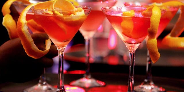 Bar waitresses prepare cocktails at a bar in Bangalore, on May 30, 2007. Women hired as bartenders in the southeastern Indian IT hub of Bangalore must wear "decent" clothes including long-sleeved shirts and trousers, according to new state government guidelines approved by a top court.