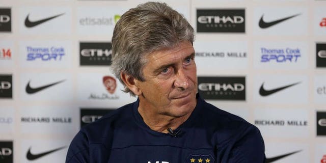 Manchester City's new Chilean manager Manuel Pellegrini attends a press conference at the team's Carrington Training Ground, in Carrington on July 10, 2013.