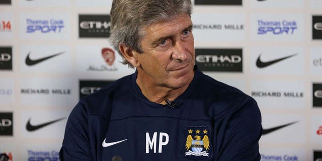 Manchester City's new Chilean manager Manuel Pellegrini attends a press conference at the team's Carrington Training Ground, in Carrington on July 10, 2013.