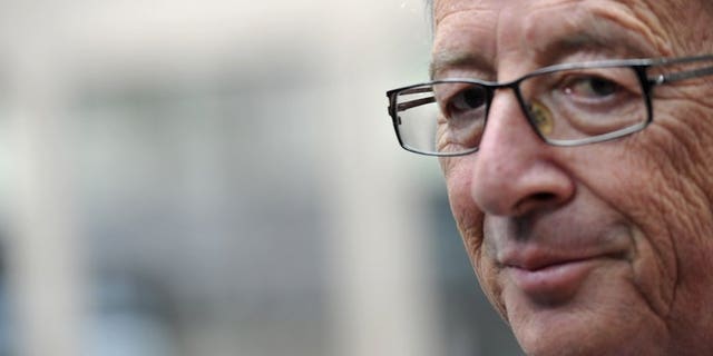 Luxembourg Prime Minister Jean-Claude Juncker, pictured June 27, 2013, said he would step down over a scandal involving the secret services, who were alleged to have indulged in a spate of misconduct on his watch.