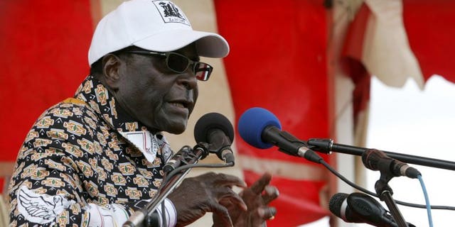 Zimbabwe President Robert Mugabe addresses an election rally in Mashonaland Central province on July 11 2013. Global rights watchdog Amnesty International has called on African blocs to ensure that Zimbabwe's upcoming elections are not marred by violence similar to the 2008 vote.