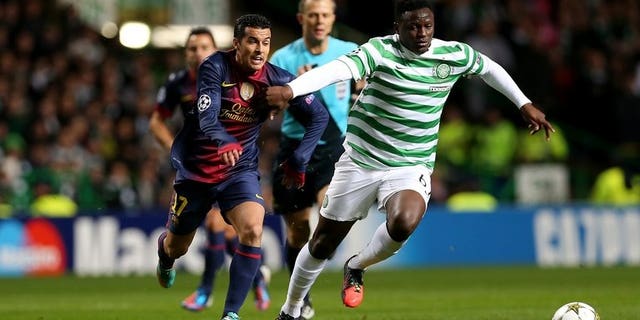 Victor Wanyama fends off Barcelona's Pedro Rodriguez in a Champions League game in Glasgow last November. Kenyans on Friday hailed national football team skipper Victor Wanyama after his move from Scottish champions Celtic to Southampton in the English Premier League.