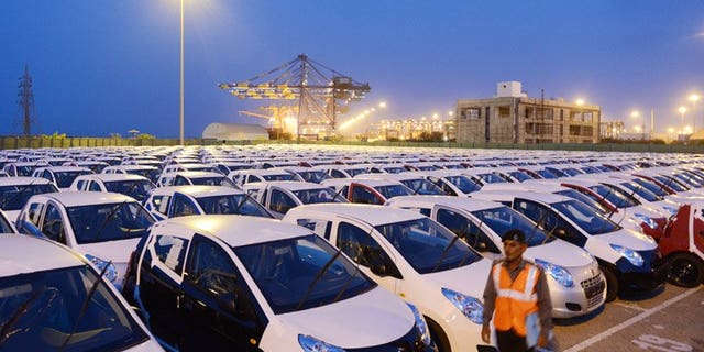 Maruti Suzuki Alto for export are parked in a holding area in Mundra last month. India's car sales slid nine percent in June, marking a record eighth straight month of decline, data showed Friday, as the industry demanded a government package to revive the once booming sector.