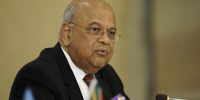South African Finance Minister Pravin Gordhan speaks during a joint press conference with World Bank newly-appointed President on September 6, 2012 in Pretoria. South Africa's top tax official has resigned following an investigation into allegations of impropriety, Gordhan announced Friday.