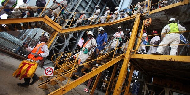 Mine workers leave on January 19, 2011 the 14 Shaft of the Impala Platinum mine in Phokeng. Two of South Africa's leading mining companies on Friday named a hardline union as the largest grouping at some facilities, raising hopes for an end to months of labour unrest.