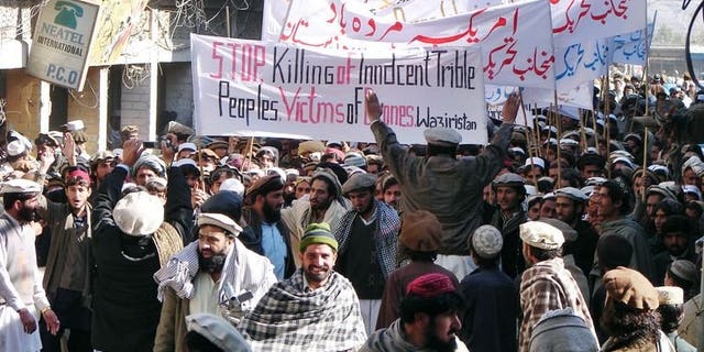 Pakistani tribesmen march in Miransha, Pakistan, during a protest rally against US drone attacks on January 21, 2011. A US drone strike in the troubled northwestern tribal belt of North Waziristan late Saturday killed two militants on a motorcycle and damaged nearby houses, officials said.