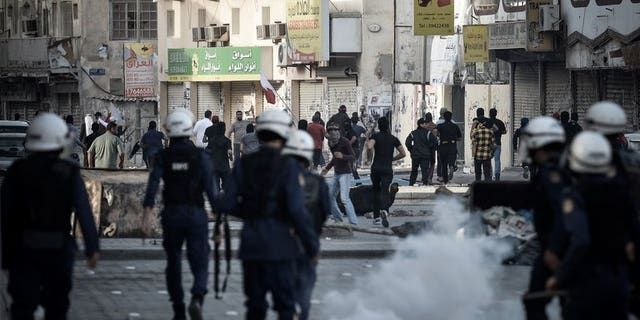 Bahraini riot police disperse protesters during a demonstration in Daih, on February 22, 2013. A home-made bomb has wounded four Bahraini policemen outside a Shiite village, the interior ministry said in the latest unrest to rock the Sunni-ruled Shiite-majority Gulf state.