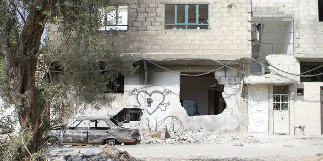 View of the destruction following fighting between rebels fighters and pro-regime forces in the Qaboun neighborhood of Damascus, on July 31,2012. Fighting between soldiers and rebels broke out on August 01,2012 for the first time near two Christian districts of Damascus, the Britain-based Syrian Observatory for Human Rights said. AFP PHOTO/IBRAHIM AL-DIMASHKI