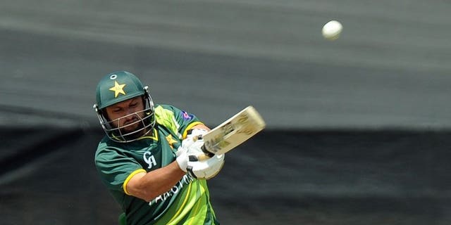 Pakistan's cricketer Shahid Afridi hits the ball in Benoni at Willowmoore Park on March 24, 2013. Hugely contrasting half-centuries by Afridi and Misbah-ul-Haq rescued Pakistan from a perilous position as they reached 224 for nine against the West Indies in the first one-day international.