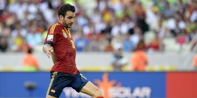 Spain's midfielder Cesc Fabregas drives the ball during a FIFA Confederations Cup Brazil 2013 match against Nigeria at the Castelao Stadium in Fortaleza on June 23, 2013. Manchester United have made a ??25 million ($37.7 million, 28.9-million-euros) offer for Fabregas, reports in the media suggested.