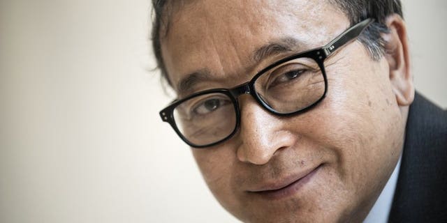 Cambodia's opposition leader Sam Rainsy seen here during a visit to Washington, DC, on May 9, 2013. A United Nations envoy has urged Cambodia to let Rainsy play a "full part" in politics as the recently-pardoned politician prepares to return ahead of elections.